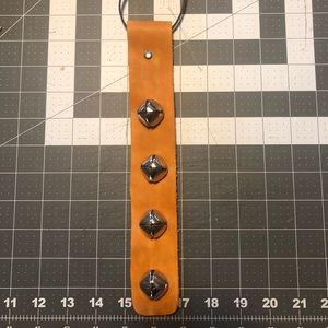 Sleigh bells on leather strap